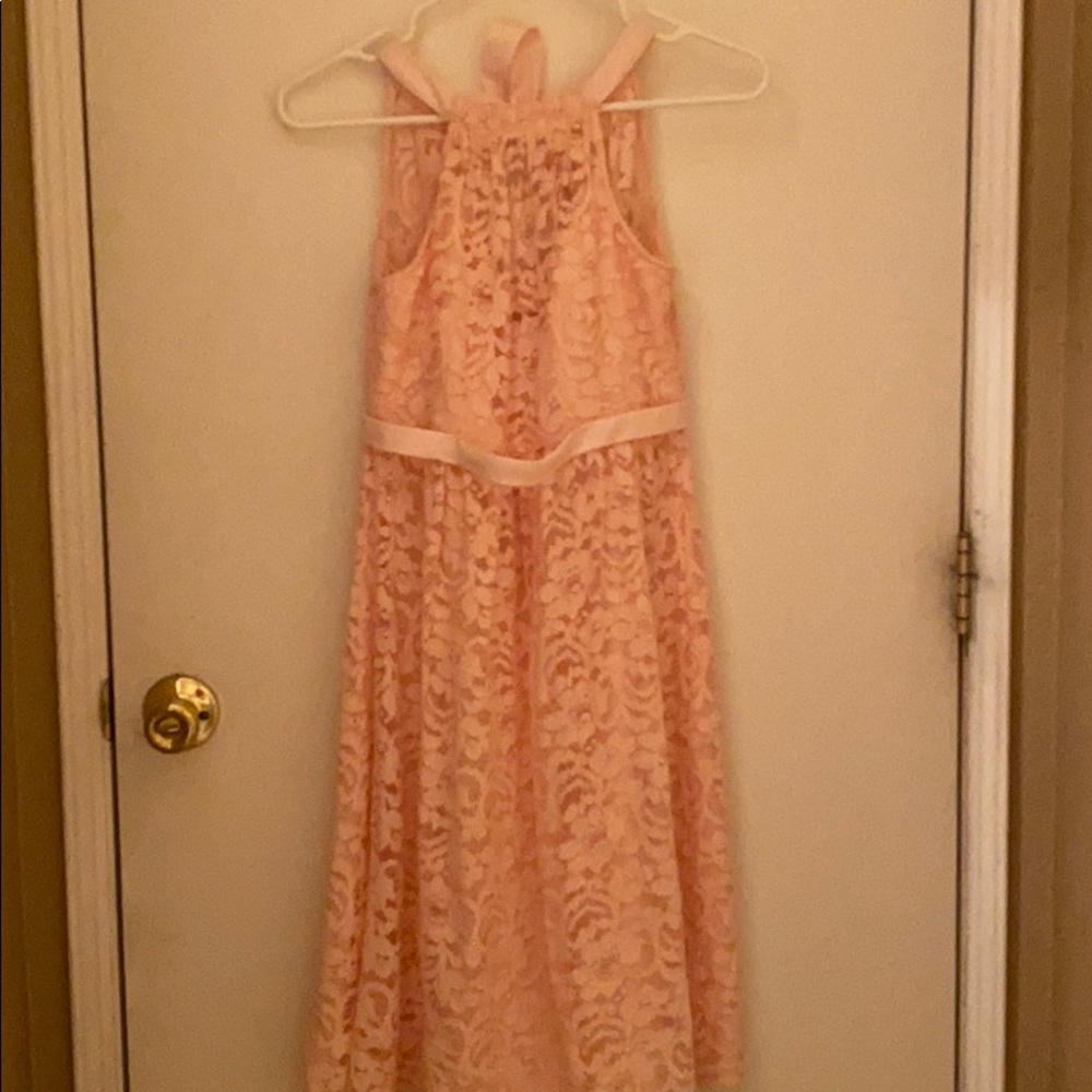 Light pink, bridesmaid dress by David’s Bridal